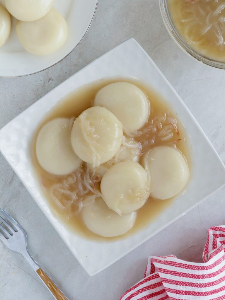 Inday-Inday – Kawaling Pinoy Inday-Inday with coconut sauce on a white serving platter.